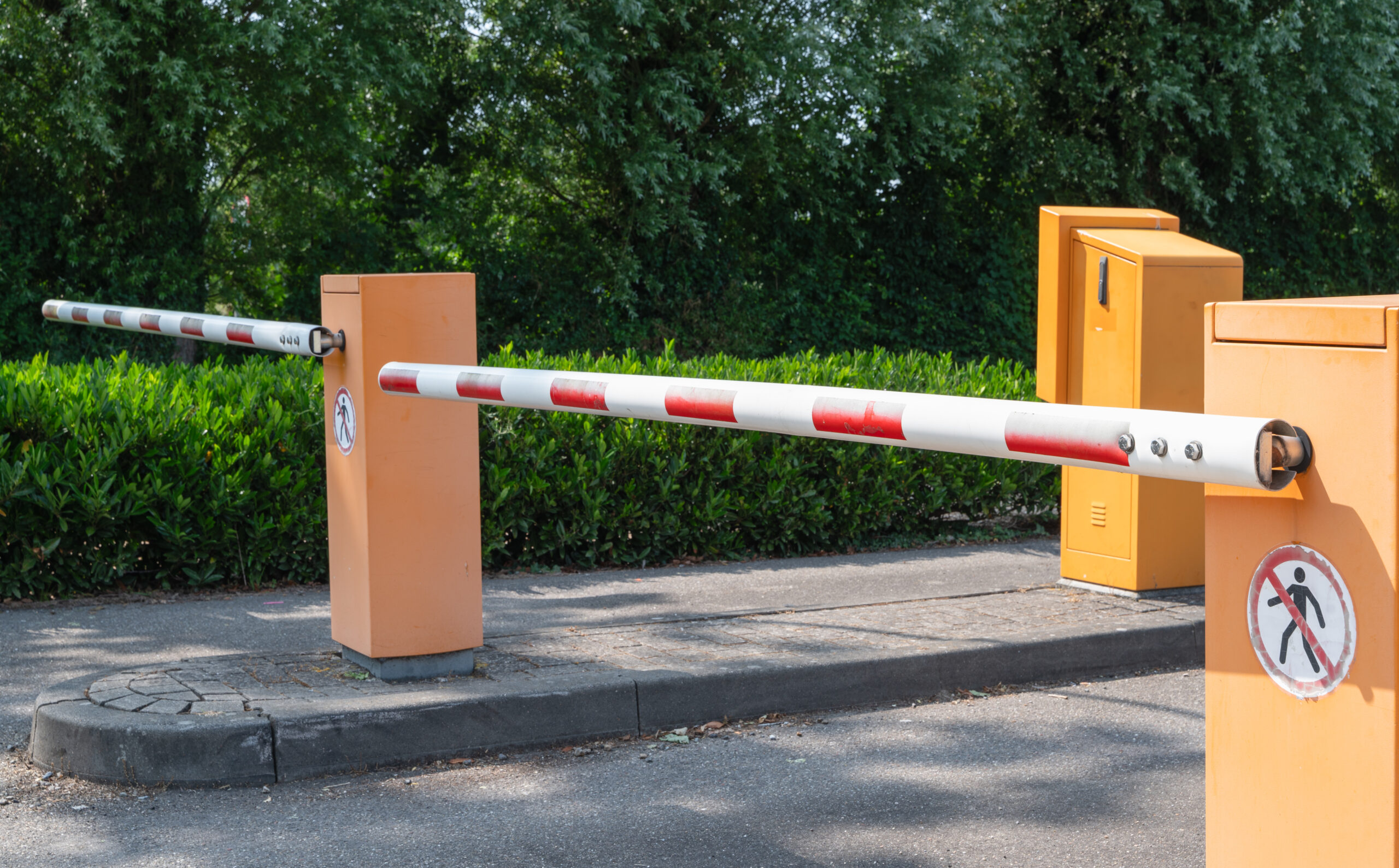 The Automated Barrier Gate System At The Parking Lot Ensures Efficient Traffic Control And Security